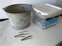 Galvanized pail of galvanized 16 d, roofing nails