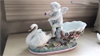 Nice porcelain Swan boat with cherub blowing a