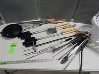 Large selection of BBQ utensils and camp fire cook