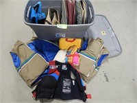 Large tote with assorted life jackets; buyer confi