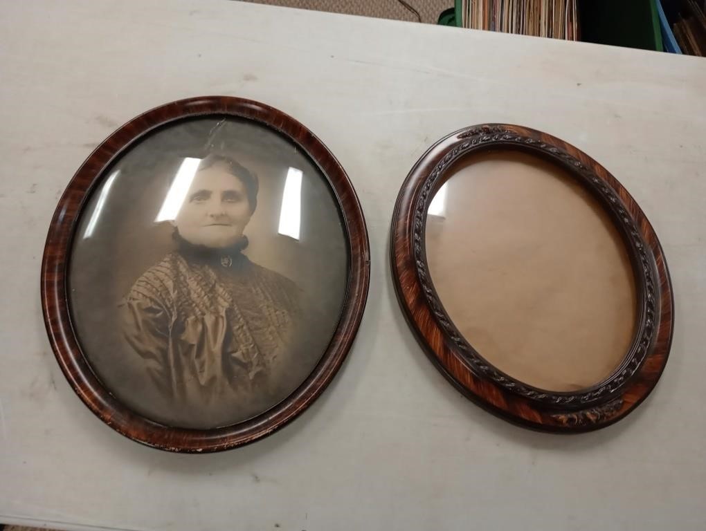 Two antique photo frames one has photo
