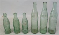 (2) 1915 era Coke Bottles with embossed Letters &