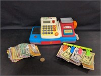 Child's cash register with play money