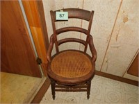 Walnut ladder back chair with hip rest & cane seat