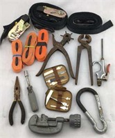 Assortment of Tools and Ratchet Straps
