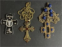 Two Betsy Johnson Cross necklaces ond one pendant