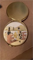 Oriental themed gold tone compact mirror