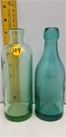 2 VINTAGE EMBOSSED BOTTLES