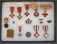 44 medals/pins, mostly Red Cross, 2 display cases.