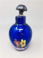 blue scent bottle with floral theme
