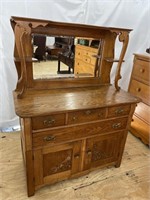 OAK CARVED BUFFET WITH MIRRORED BACK