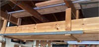 Pile of scrap lumber in garage rafters