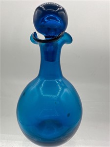 Blue perfume bottle with stopper