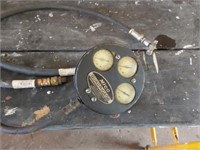 Quadrigage meter and hydraulic hoses