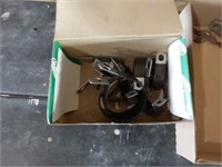 Large assortment. Of rubber coated pipe clamps