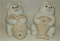 Fat White Cats Holding Fish