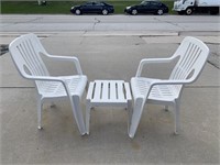 Two Plastic Outdoor Chairs And Side Table
