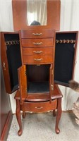 Standing wooden jewelry hutch