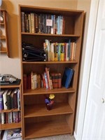 6 ft tall bookshelf and remaining books