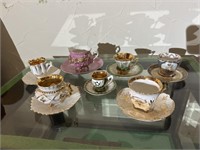 Group of antique tea cups and demitasse cups incl