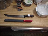 Large R. H. Forschner kitchen knife, sharpener.