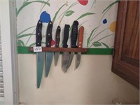 Group of assorted knives and wall mount wooden