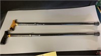 Pair of adjustable walking canes. Metal with wood