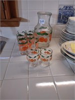 Vintage orange juice jar and 6 matching glasses.