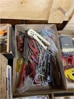 assorted tools including ratchet pliers tape