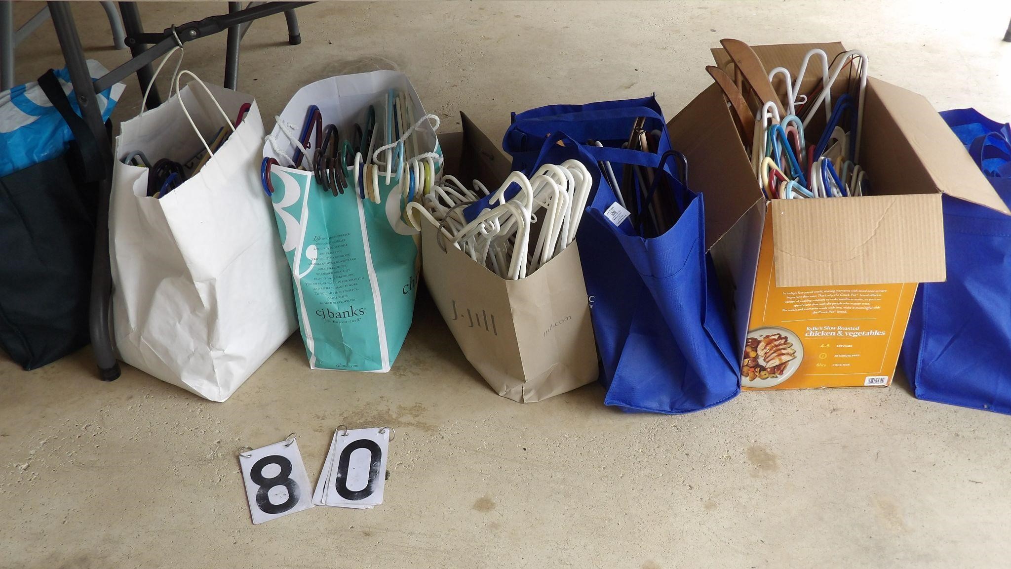 7 Bags Of Plastic Coat Hangers