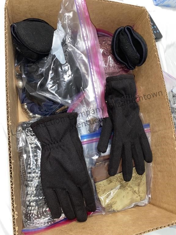 Box of scarves and gloves, nail clippers and