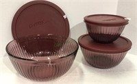 Set of three Pyrex smoked glass bowls with