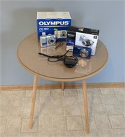 Table, Sony Camera, and Olympus Camera - Cameras