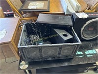 RCA DVD player, speakers, plastic crate