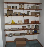 Large lot of brass and wooden frames and bookends