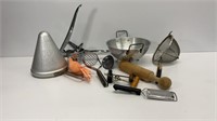 Vintage kitchen items: strainers, hand juicers,