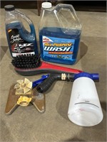 Car wash soap, scrub brush, sprinkler, soap hose