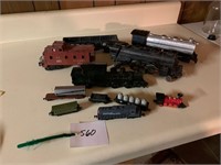 ASSORTMENT OF VINTAGE TRAINS AND A BOTTLE
