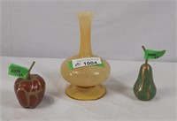 Apple and pear art pieces and a yellow vase
