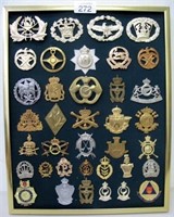 Panel of various cap badges includes Singapore