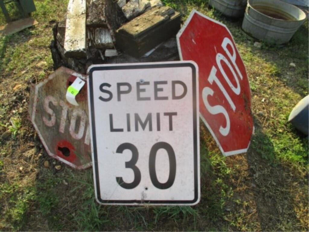 2 stop signs and speed limit