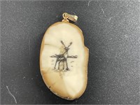 Fossilized ivory cross piece pendant with elk scri