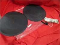 Two vinyl rubber mats and 45 record adapters