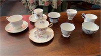 MANY CHINA COFFEE CUPS , SOME WITH SAUCERS