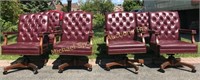 SET OF EIGHT TUFTED BURGUNDY LEATHER SWIVEL CHAIRS