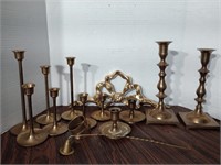 Brass candle holders, 2 napkin rings, a candle