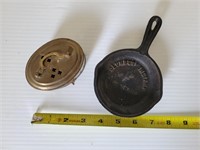 Cast iron skillet marked Columbus IN and brass box