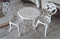 Cute 3 piece cast patio set. Table measures 23"