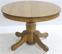 Round Oak Pedestal Table w/ 3 Leaves