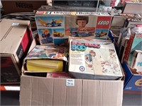 box of legos and board games